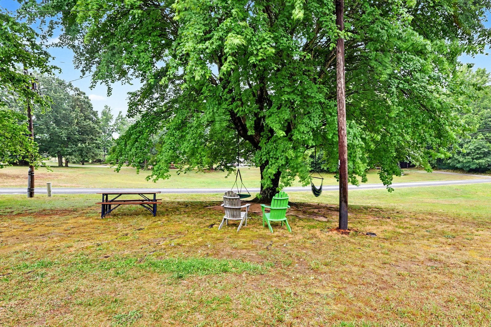 Backyard fire pit and mature trees at 1070 Legion Club Road Salisbury NC