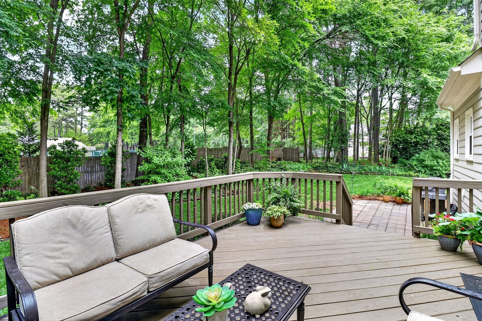 Outdoor deck overlooking backyard