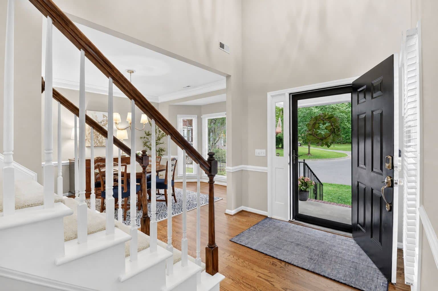 Bright foyer with refinished hardwood floors